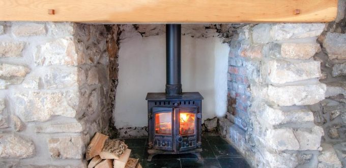The fireplace in Berry Hall Cottage